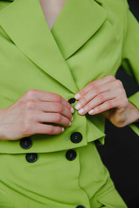 lime green mini skirt with black buttons